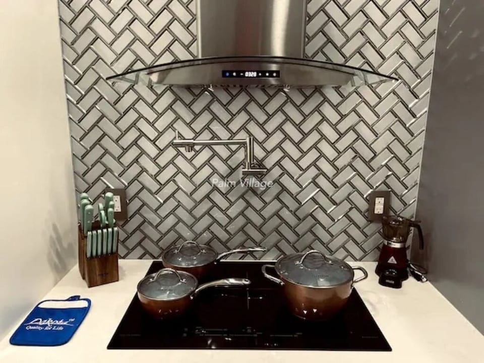 Induction cooktop with induction pans.
Martha Stewart Kitchen tools.
Pot Filler.