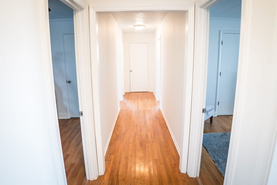 Hallway Leading to Bedrooms and Bathrooms, Providing Access to Private Spaces.