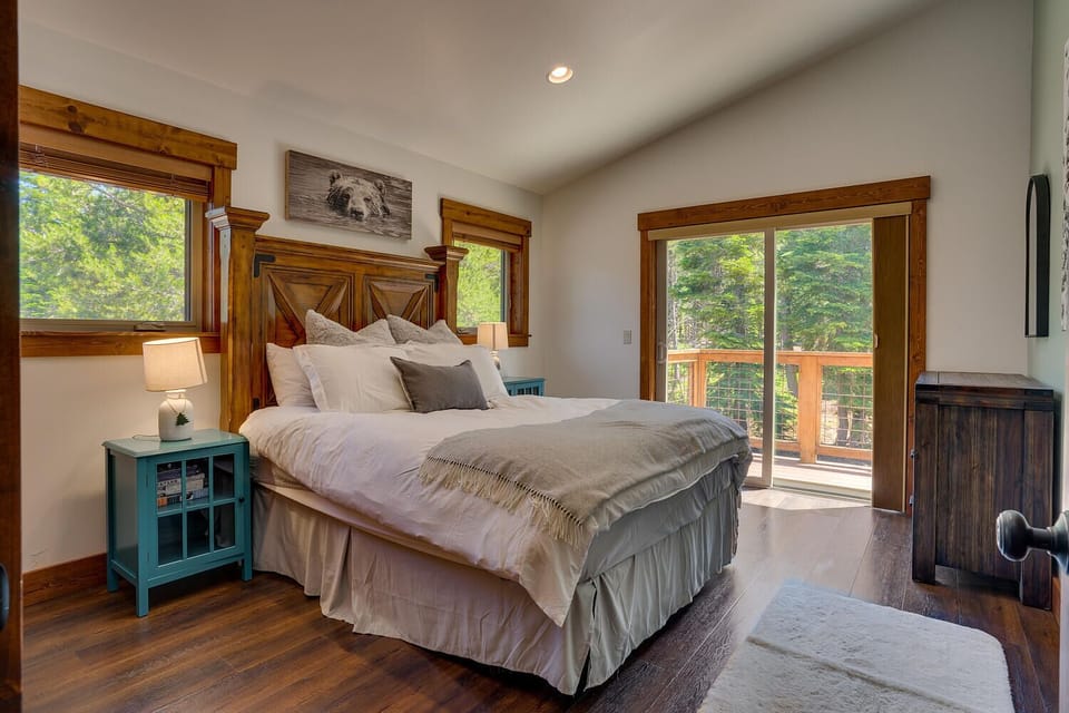Queen bed upstairs with balcony access