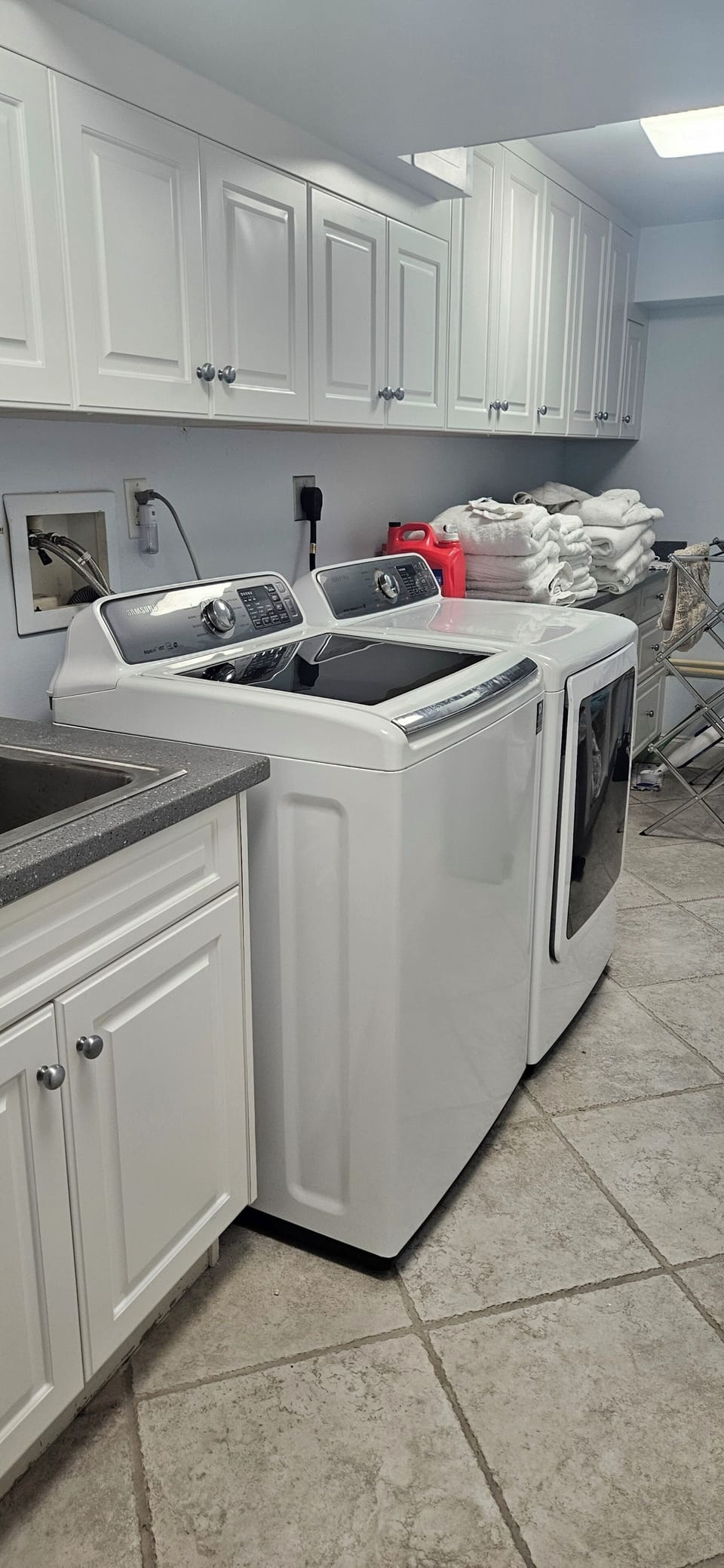 Laundry room with large washer and dryer