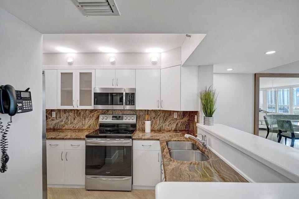 Fully equipped kitchen with counter seating for two.