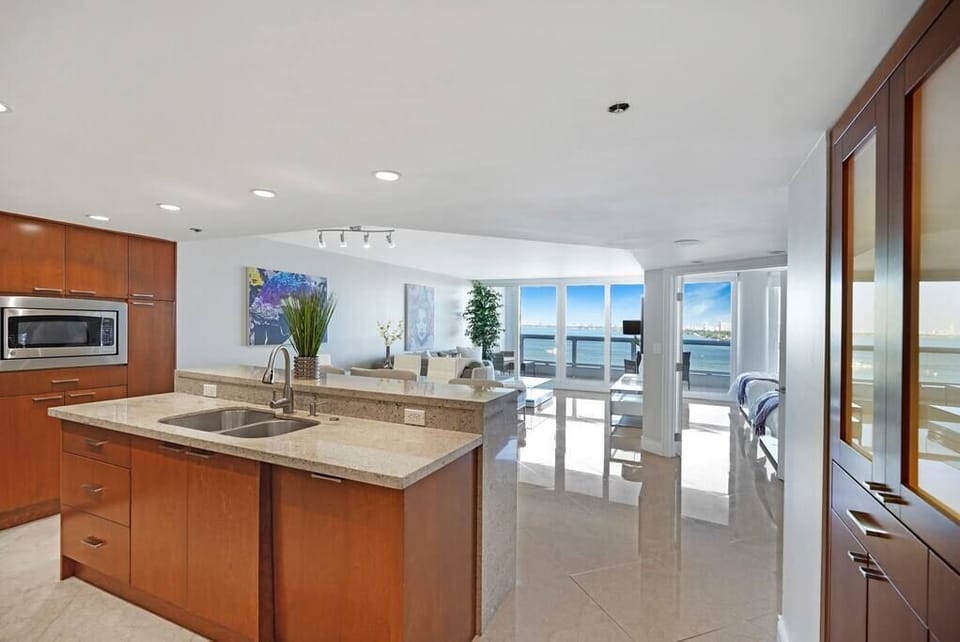 Fully equipped kitchen with views into dining/living area