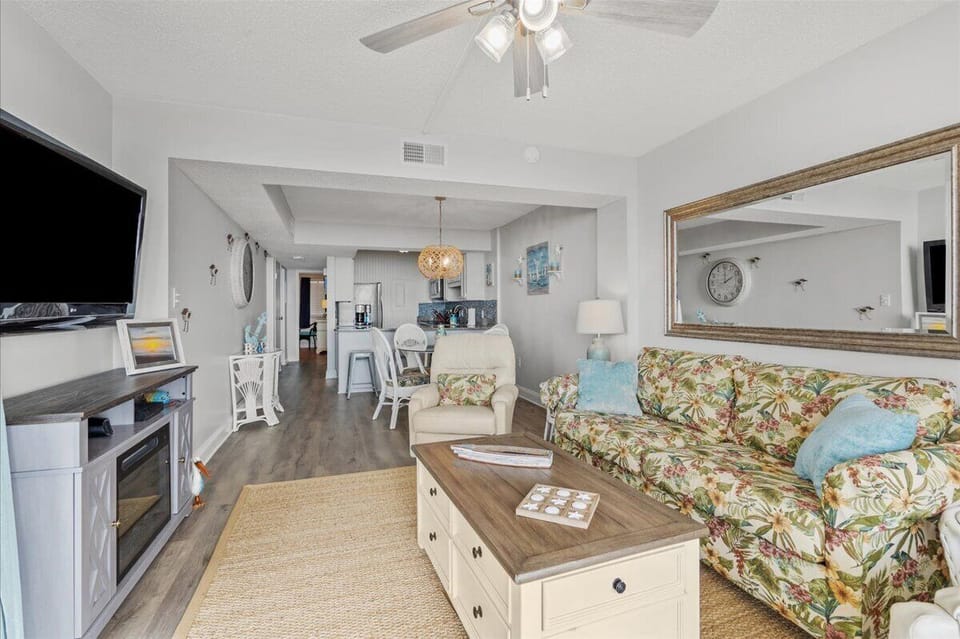Updated paint and floors throughout, new decor on wall opposite dining room
