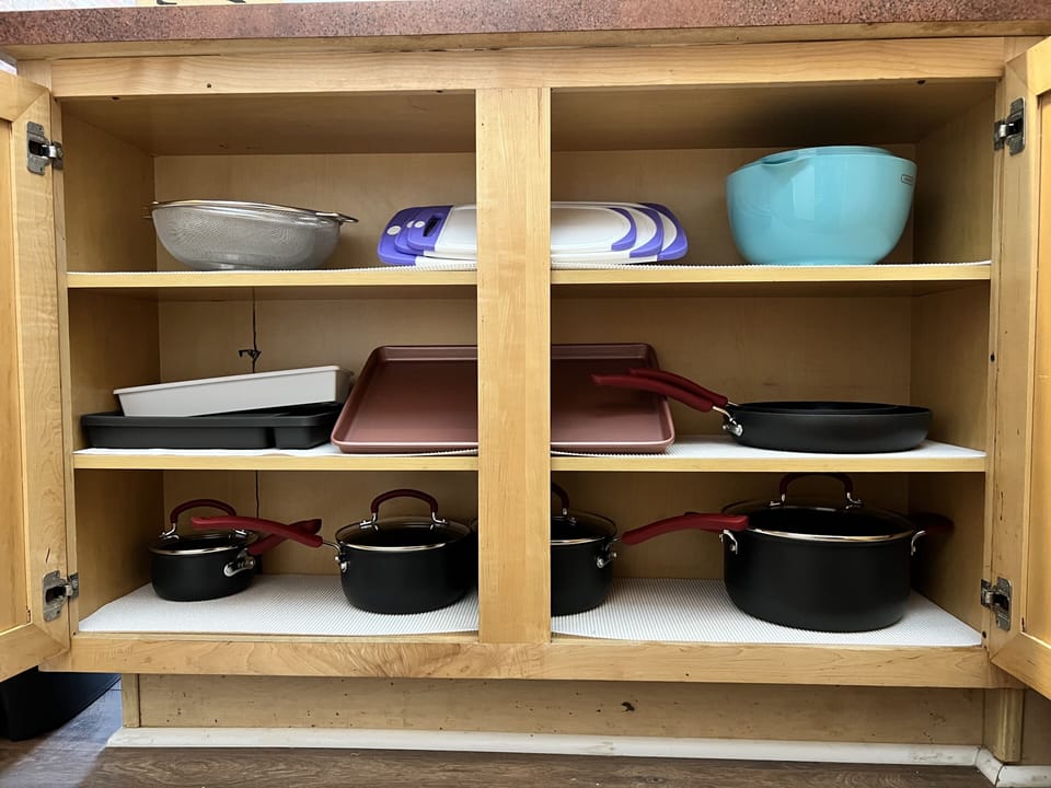 Full stocked kitchen - pots/pans, bakeware, mixing bowls, and essential utensils