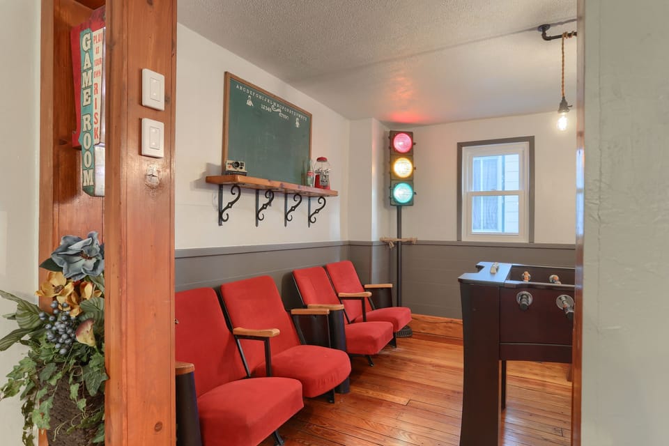 Comfy padded opera seats in Game Room to watch all the happenings and keep score