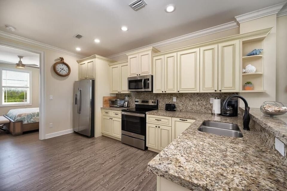 Kitchen stocked with essential appliances and cookware