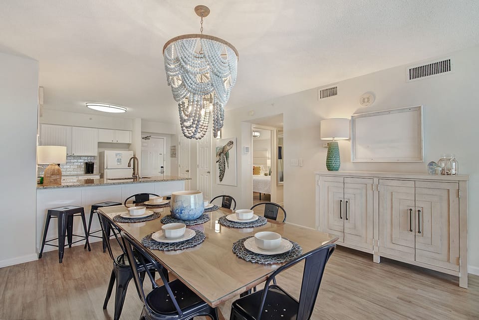 Your elegant dining area features a stunning chandelier and seats six comfortably for memorable meals together.