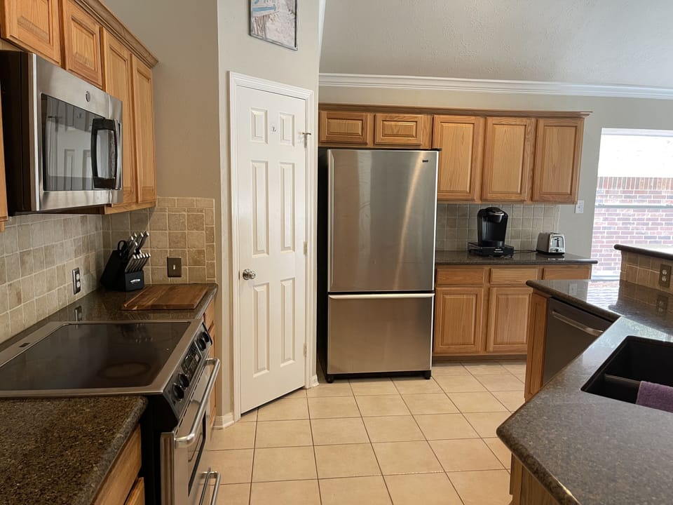 Kitchen with granite countertops and stainless appliances