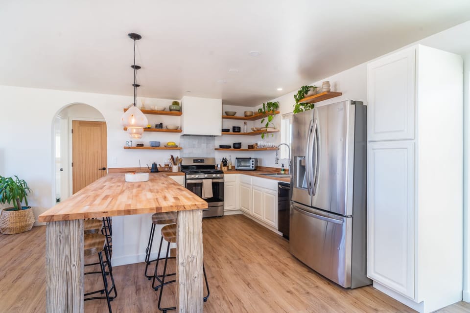 Open concept kitchen is so nice for cooking and hanging with your friends.