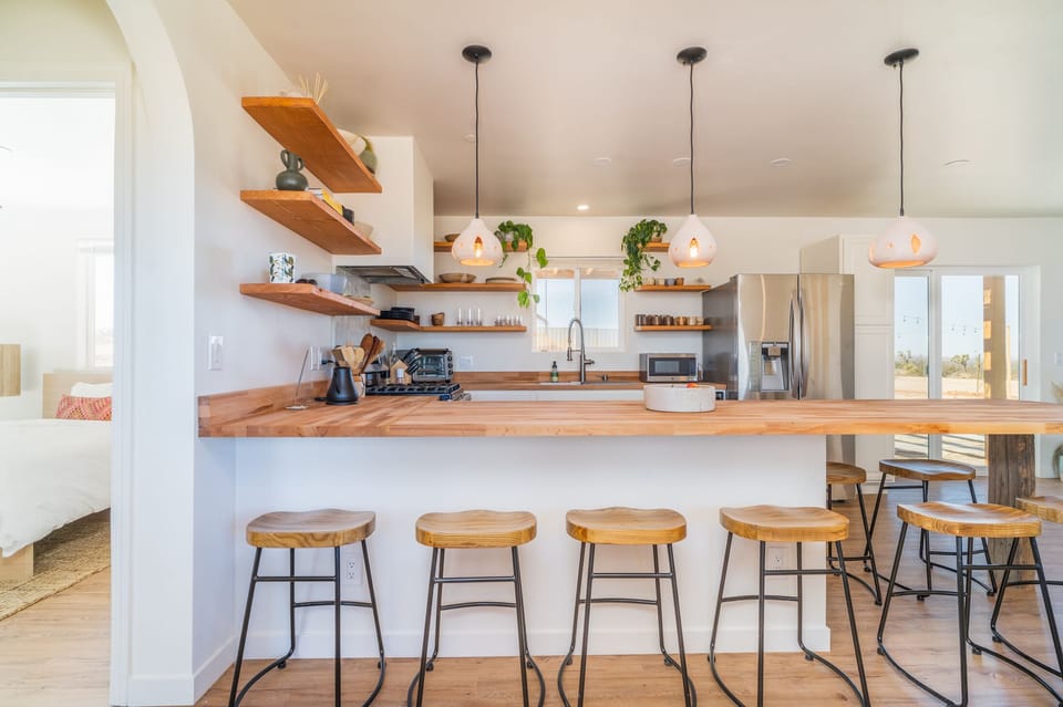 The bar area doubles as a kitchen table, food prep area, bar and work station.