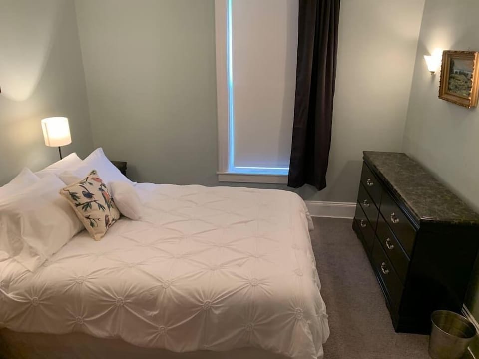 Queen-sized bed, closet, wireless charger, desk & chair, dresser