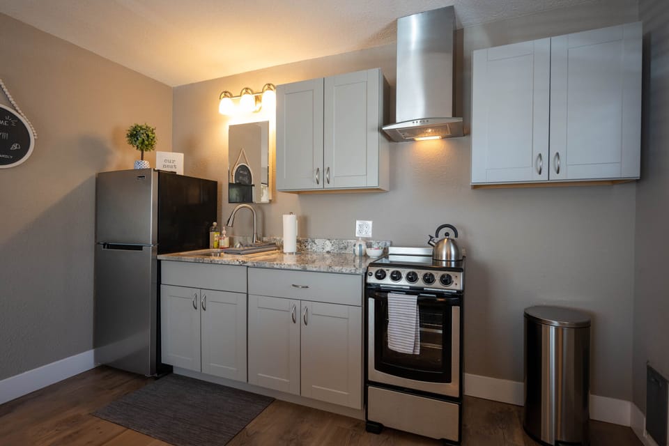 Full kitchenette: stainless fridge, stove dual sink, granite countertops.