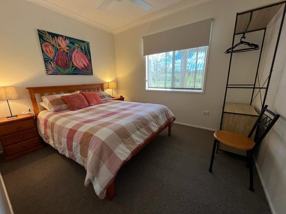 Bedroom1, north facing, queen bed, ceiling fan.
