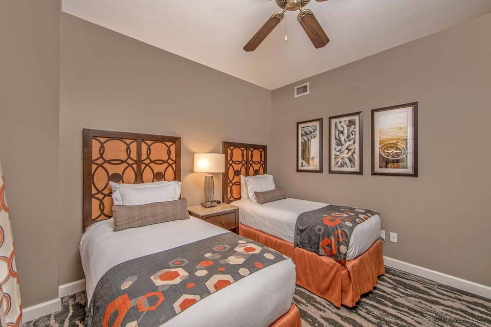 Secondary guest bedroom is complete with (2) single beds.