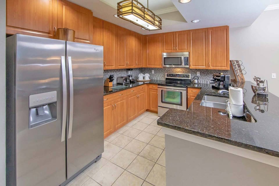 Kitchen complete with stove/oven, microwave, full refrigerator and coffee maker.