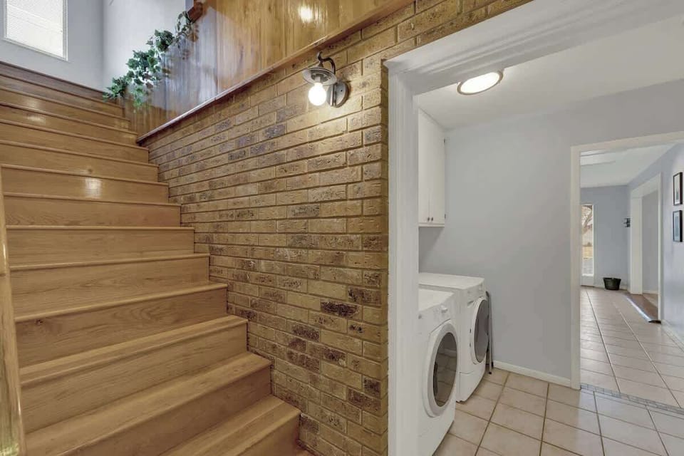 Head up to the second floor, where you'll find the 5th bedroom, game room, and the 4th bathroom. Pack lightly and take advantage of the washer and dryer for guest use. 