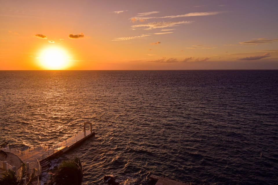 Take a stroll out to the dock for an up close look at the coastal sunset, and dip your toes in the water while sipping a tropical cocktail!