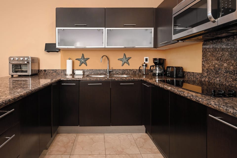 Your fully-equipped kitchen with modern appliances and granite countertops makes it easy to prepare meals in the comfort of your vacation home.