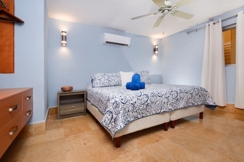 Main level bedroom with king bed