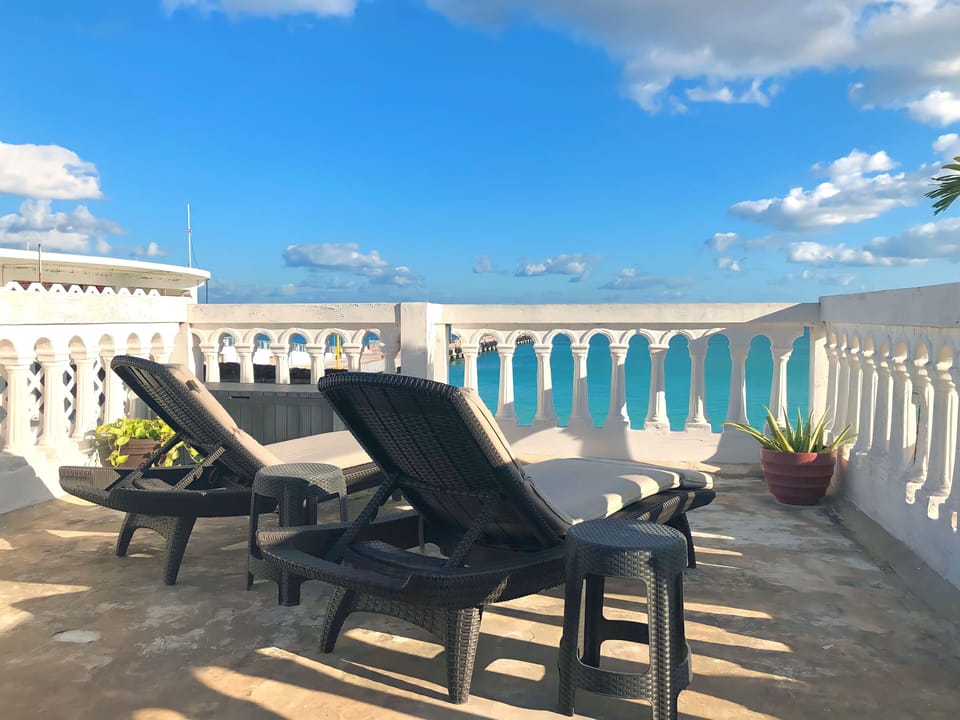 Sit back and sip your morning coffee as you wake up with panoramic ocean views on our private terrace.