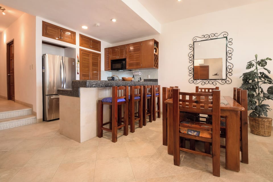 Gather for meals in the open dining area with seating for six