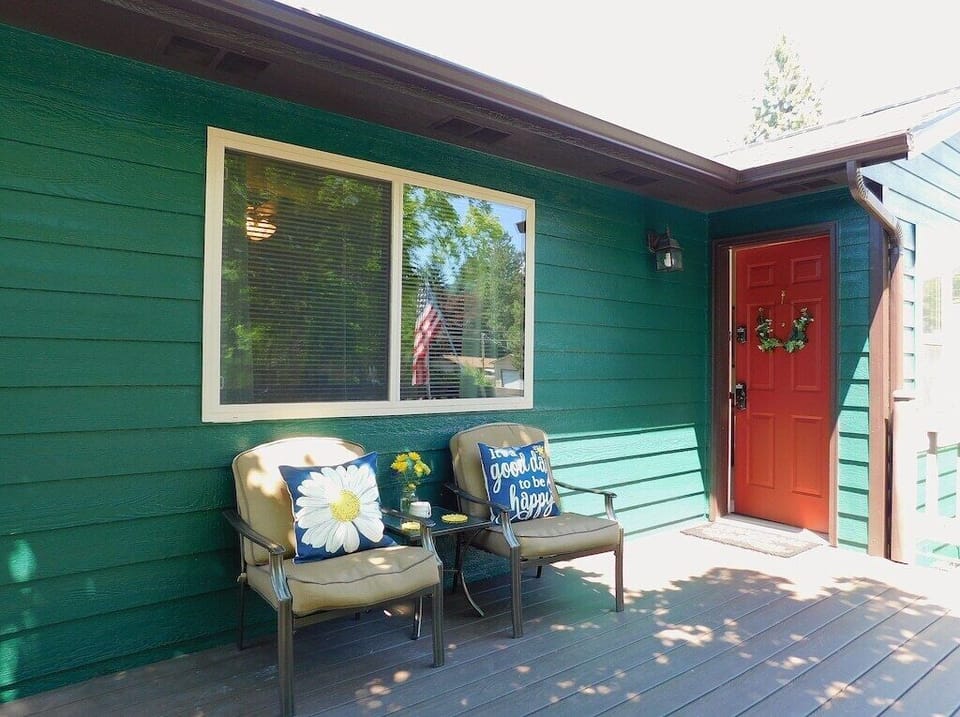 Sip tea and soak in the sun on this vibrant entryway's inviting seating!