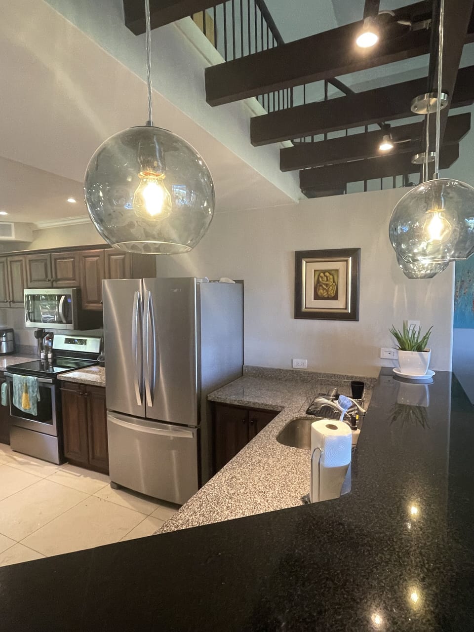 Spacious and well equipped kitchen with  bar that seats 4.