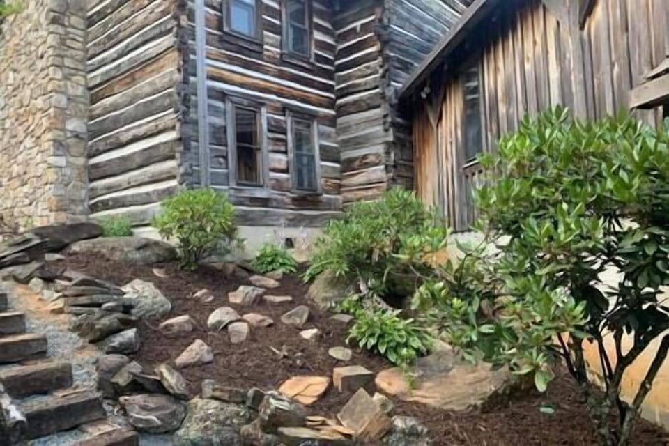 An exterior view of the enclosed breezeway leading up the main lodge. 