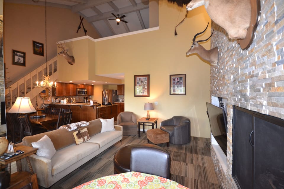 Main level living room with gas fireplace.