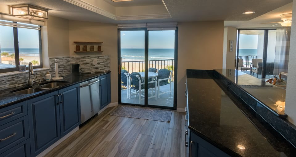 Enjoy ocean views from the kitchen.  Step right out the slider to balcony dining