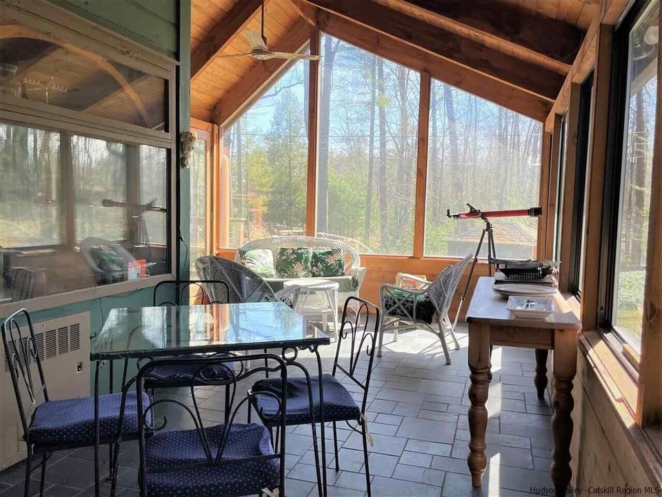 Glassed in porch off of kitchen