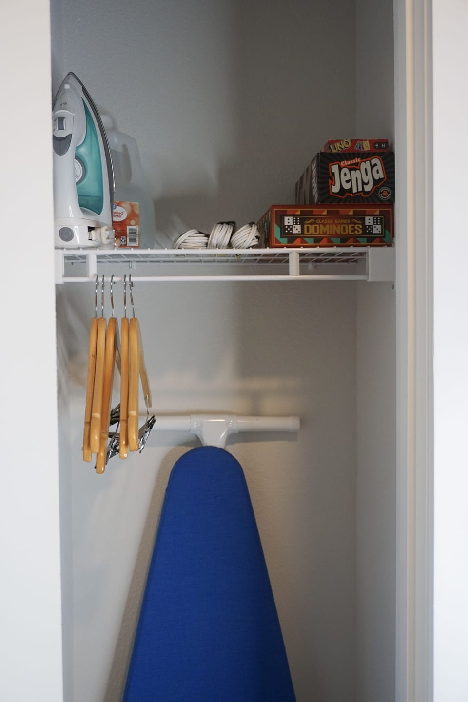 Hall way closet - iron/ironing board/games/ use distilled water for iron.