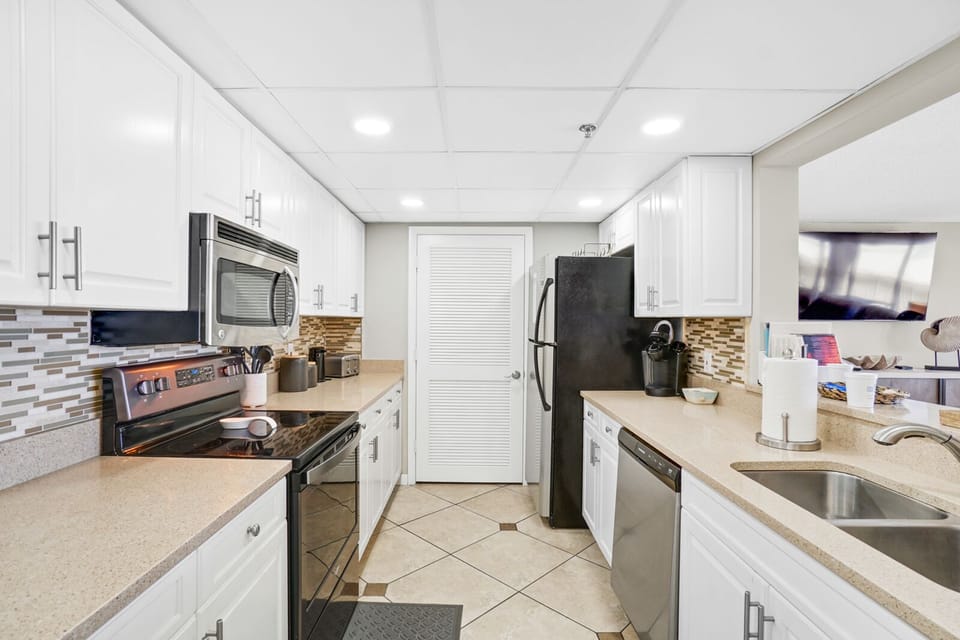 Your fully equipped kitchen awaits with modern appliances, spacious counters, and everything needed to create memorable meals during your stay.