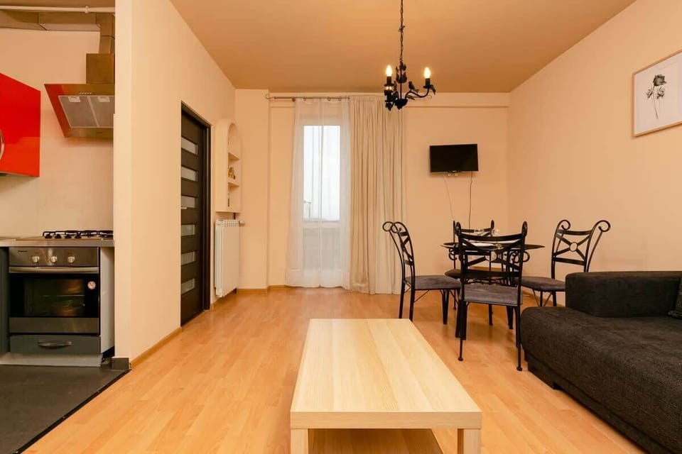 Living room with sofa and dining table.