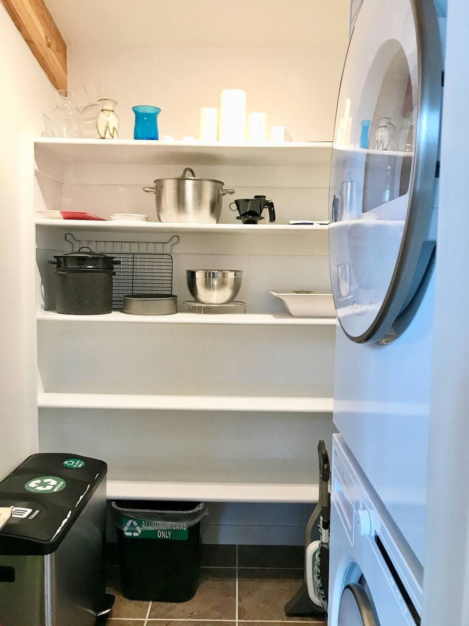 Asko Stackable washer and dryer is in the pantry located off of the kitchen.  Lots of storage space for food and personal items.