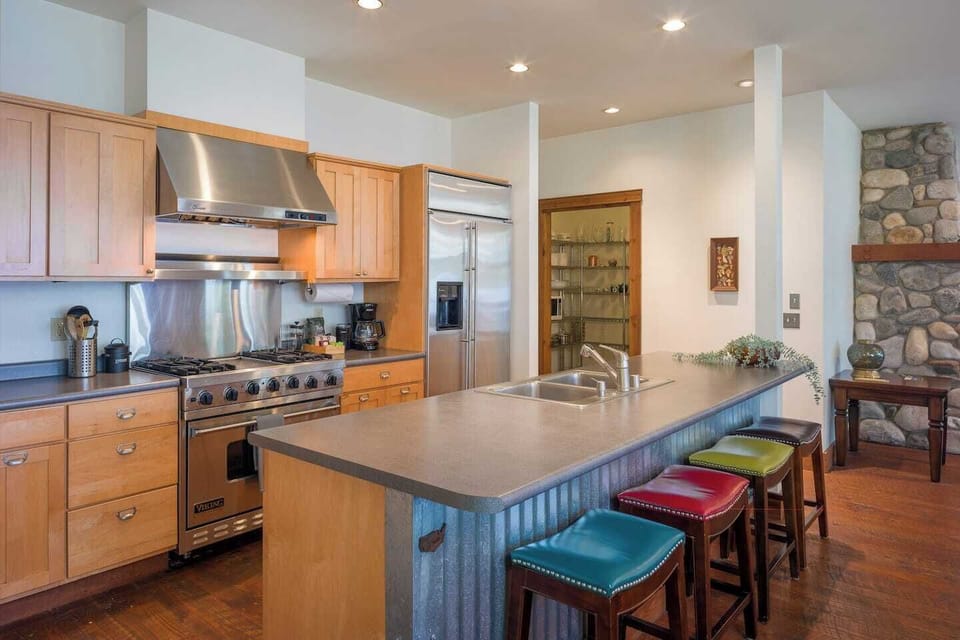 The spacious kitchen features full pantry access and comes fully equipped with modern appliances and essential gadgets—ideal for preparing everything from quick snacks to full meals with ease.