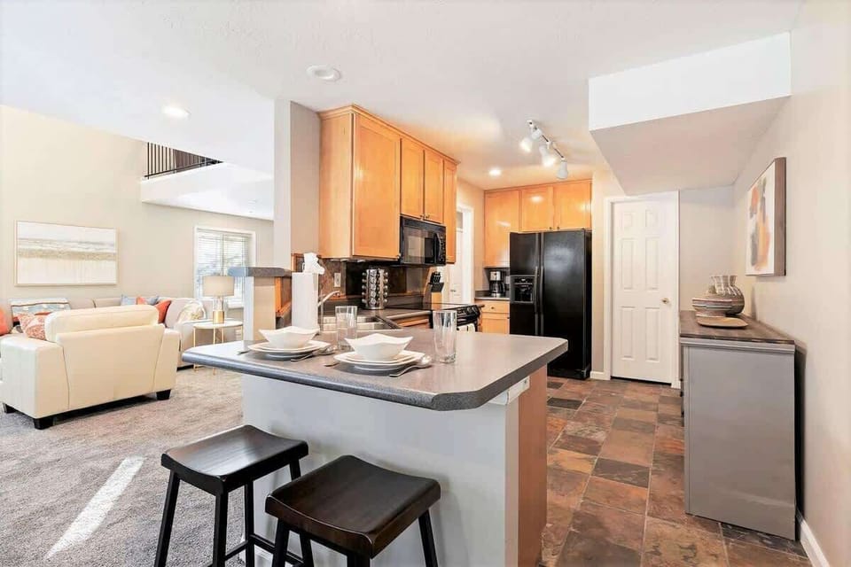 Open concept full kitchen with bar seating for 2