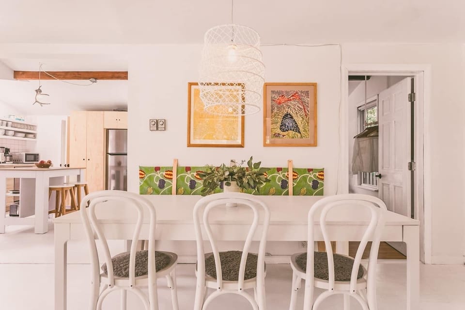 The living/dining room and kitchen have been opened up to one big space. The dining table comfortably seats six people.