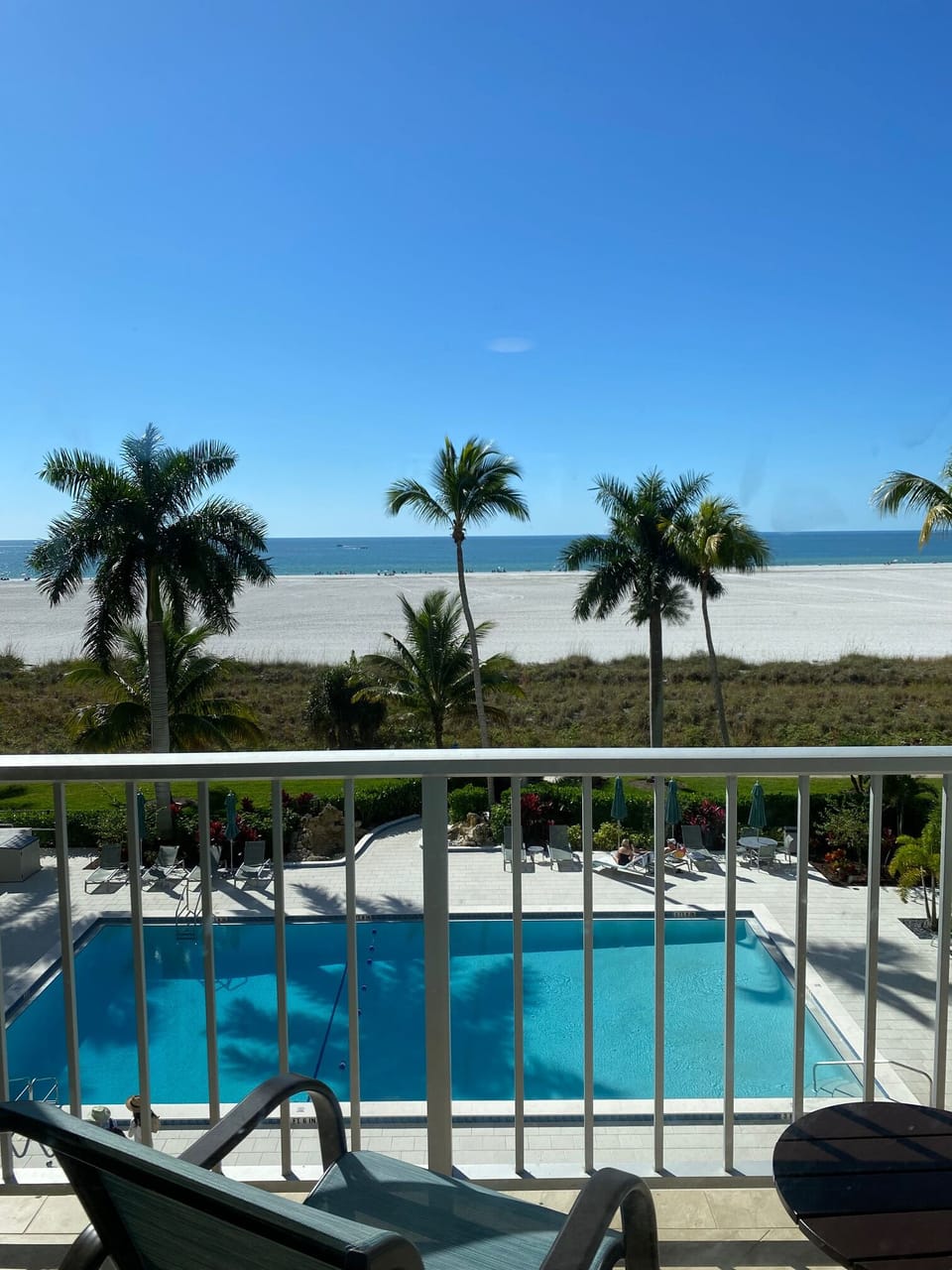 View from our balcony overlooking pool and beach