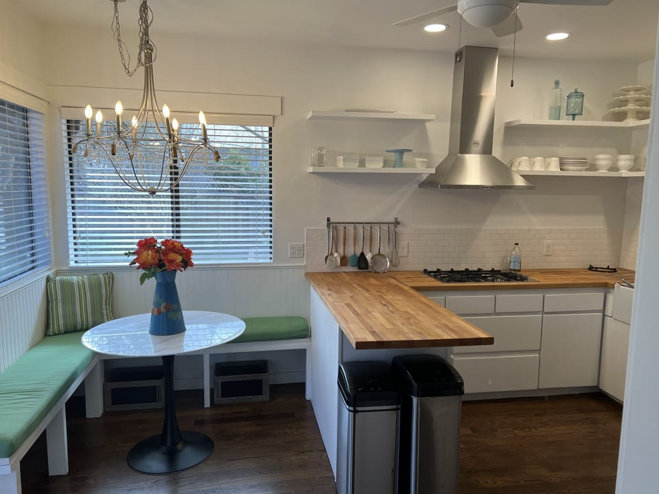 Kitchen breakfast table.  Door to outside patio on left. 