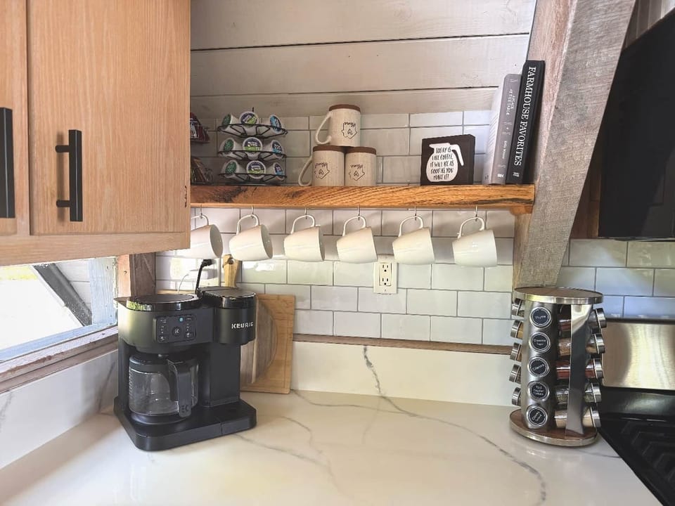 Coffee maker, coffee supplies, tea and fully stocked spice rack