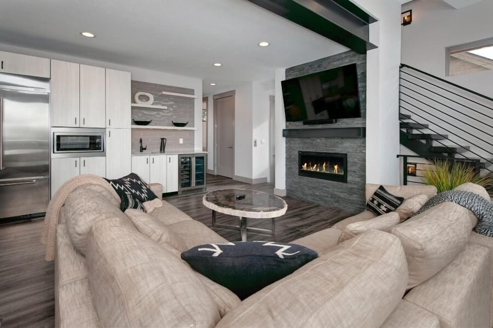 Main level living area with smart TV and gas fireplace.