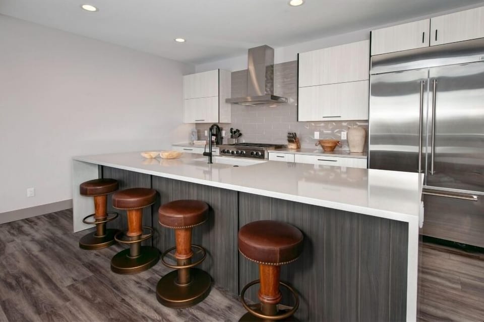 Bar area and kitchen on the main level of the property.