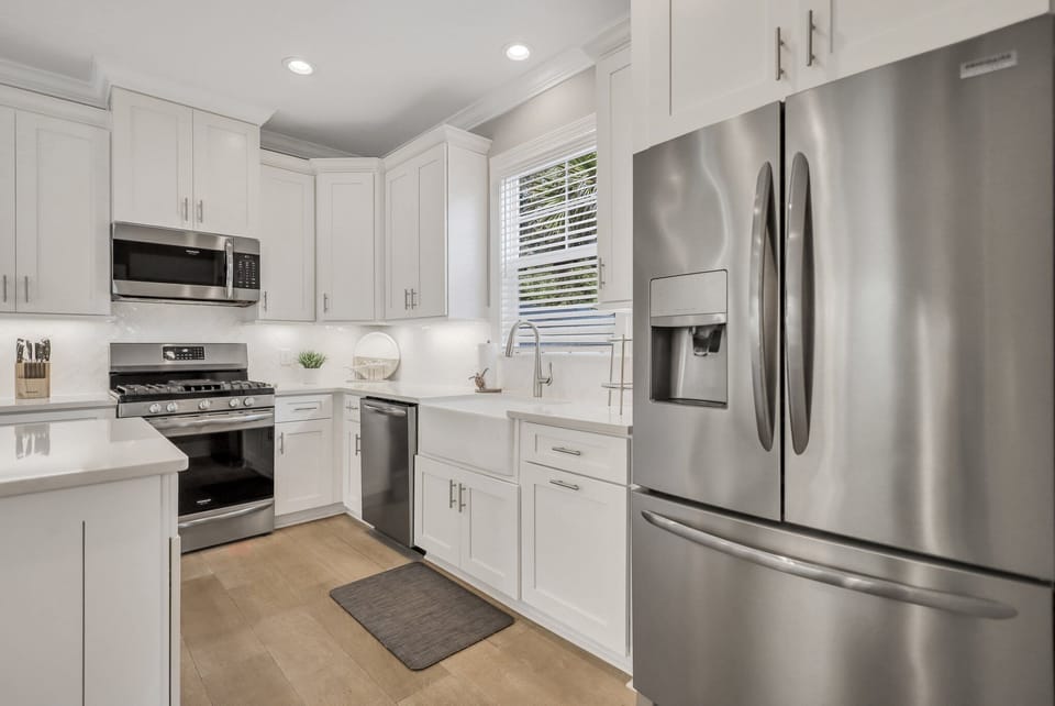 Kitchen with a gas range and stainless steel appliances