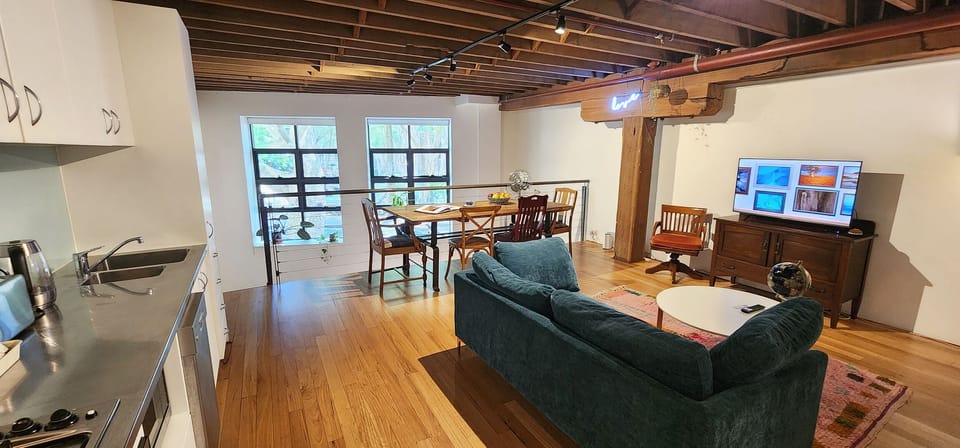 Cool New York loft style vibes. Open plan living, dining and kitchen
