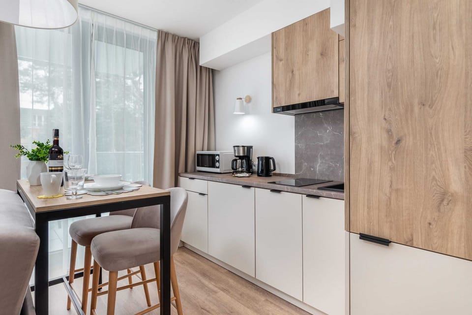 Functional bright kitchen with quality appliances that allow you to prepare home-cooked meals.