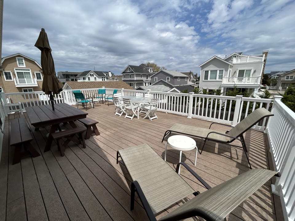 Large deck with 2 large dining tables - seat 12 people!