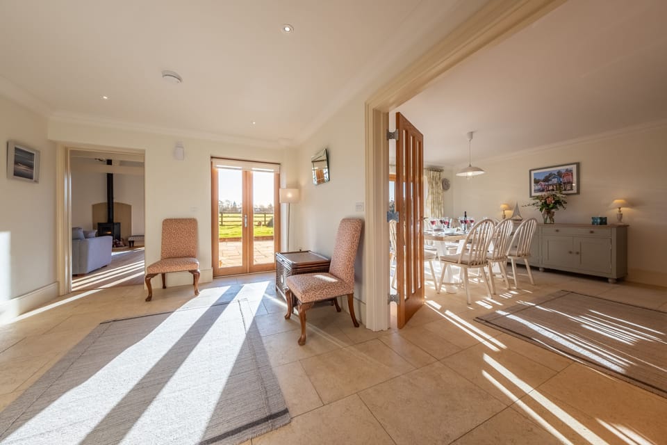 Ground floor: Double doors open to the hallway