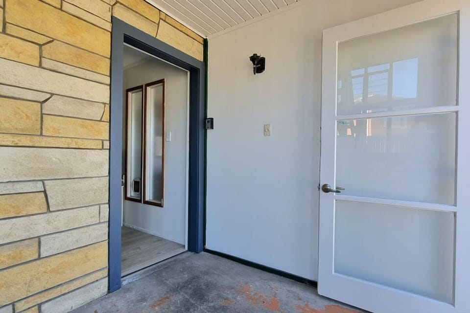 The entry into the downstairs unit, the stairs to the left are for the upstairs unit.