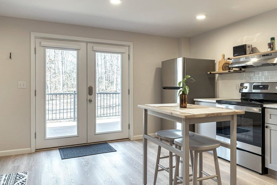 Kitchen area with full sized fridge
